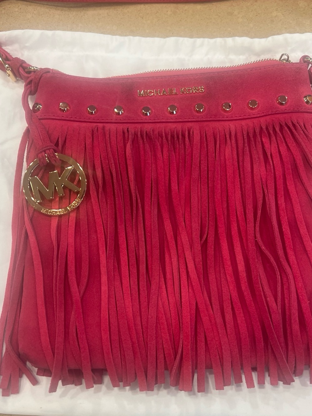 Michael Kors Pink Suede Fringe Crossbody with Gold MK Charm